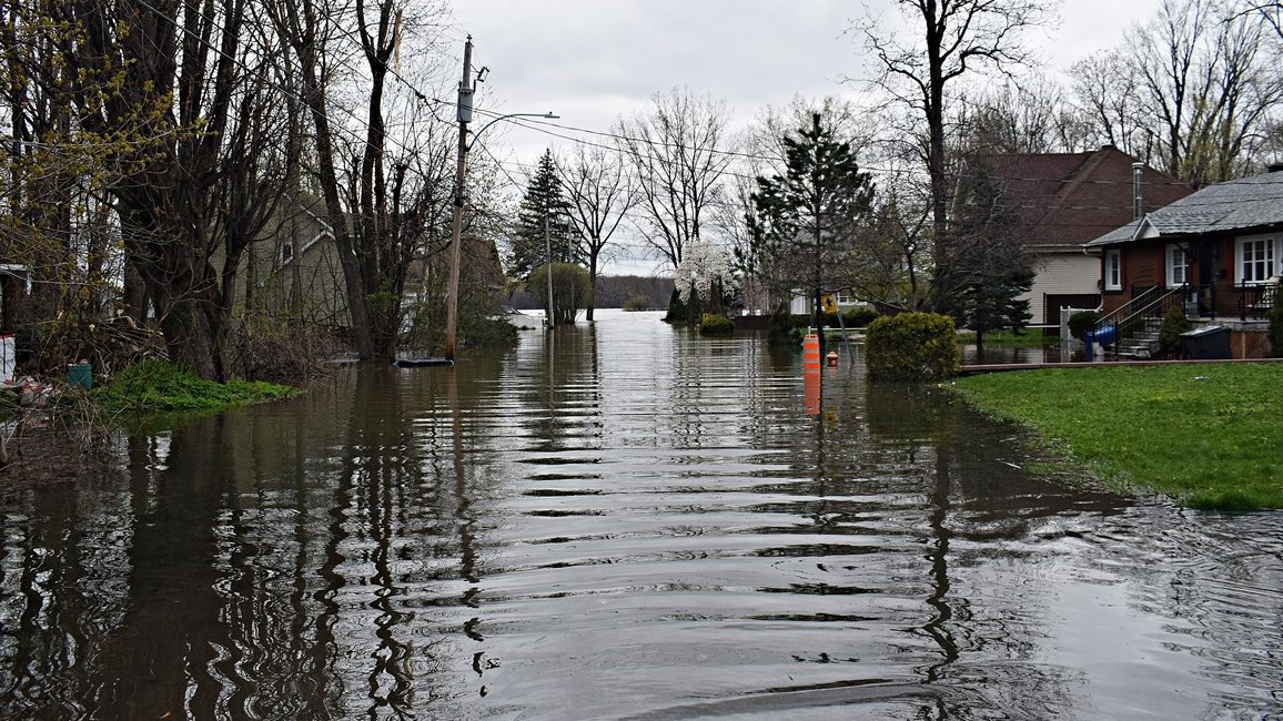 Flood waters cover a street near the waterfront in Terrasse-Vaudreuil