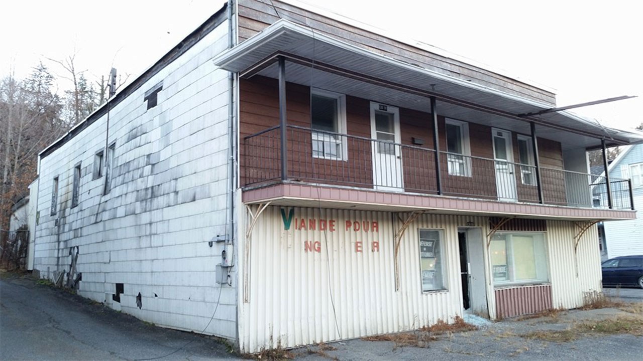 L'ÉPICERIE DE J. ERNEST BUREAU SUR LA PREMIÈRE AVENUE